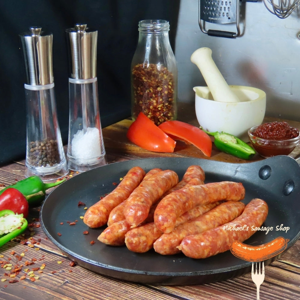 Raw Merquez Sausages on a pan. By Michael's Sausage Shop.